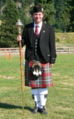 Drum major wearing a Glengarry cap and Prince Charlie jacket