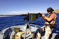 File:Coast Guard sailor points 50 caliber MG -- Guantanamo.JPG
